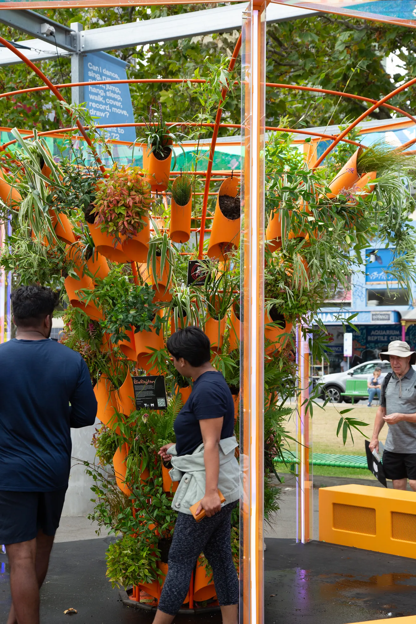 Visitors looking up into the planted tower